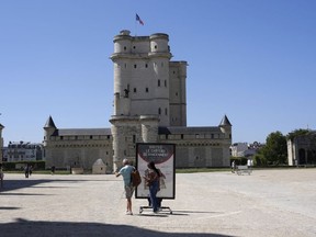 People arrive to visit the Chateau de Vincennes, a massive fortress just east of Paris, Tuesday, Aug. 12, 2025.