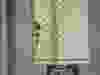 Raymond Boodarian hides behind a door.