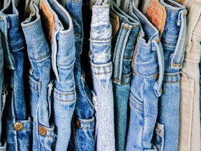 A rack of second hand jeans