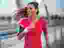A woman is pictured running on a summer morning.