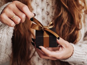 Small jewelry giftbox. Birthday surprise. Opening present.