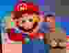 Marc Saltzman, seen here with Mario, gives a big thumbs up to the Nintendo Switch 2 after it was released on Thursday, June 5, 2025.