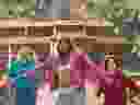 Jack Black, left, Jason Momoa, centre, and Sebastian Hansen in a scene from “A Minecraft Movie.” 