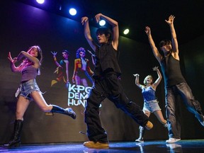 People dance to the song "Soda Pop" at a "KPop Demon Hunters"-themed singalong event at the Onmam Theater in the Hongdae district of Seoul on Thursday.