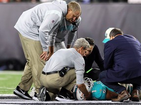 Medical staff tend to quarterback Tua Tagovailoa
