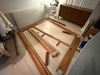 Setting up the Tofino bed frame with the already unboxed Tofino dresser.