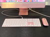 iMac M4's matching pink keyboard, mouse and cables.